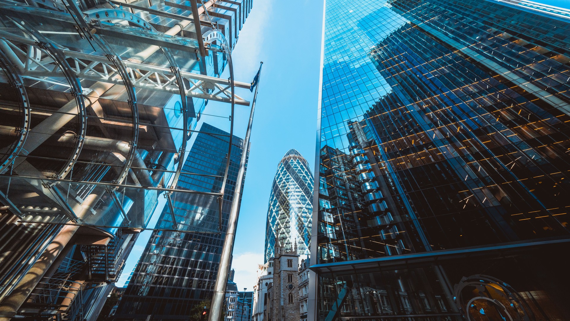 Looking directly up at the skyline of the financial district in central London